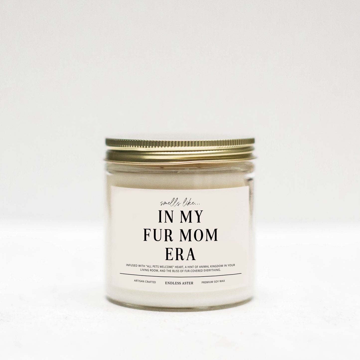 a white jar with a label that says in my fur mom era