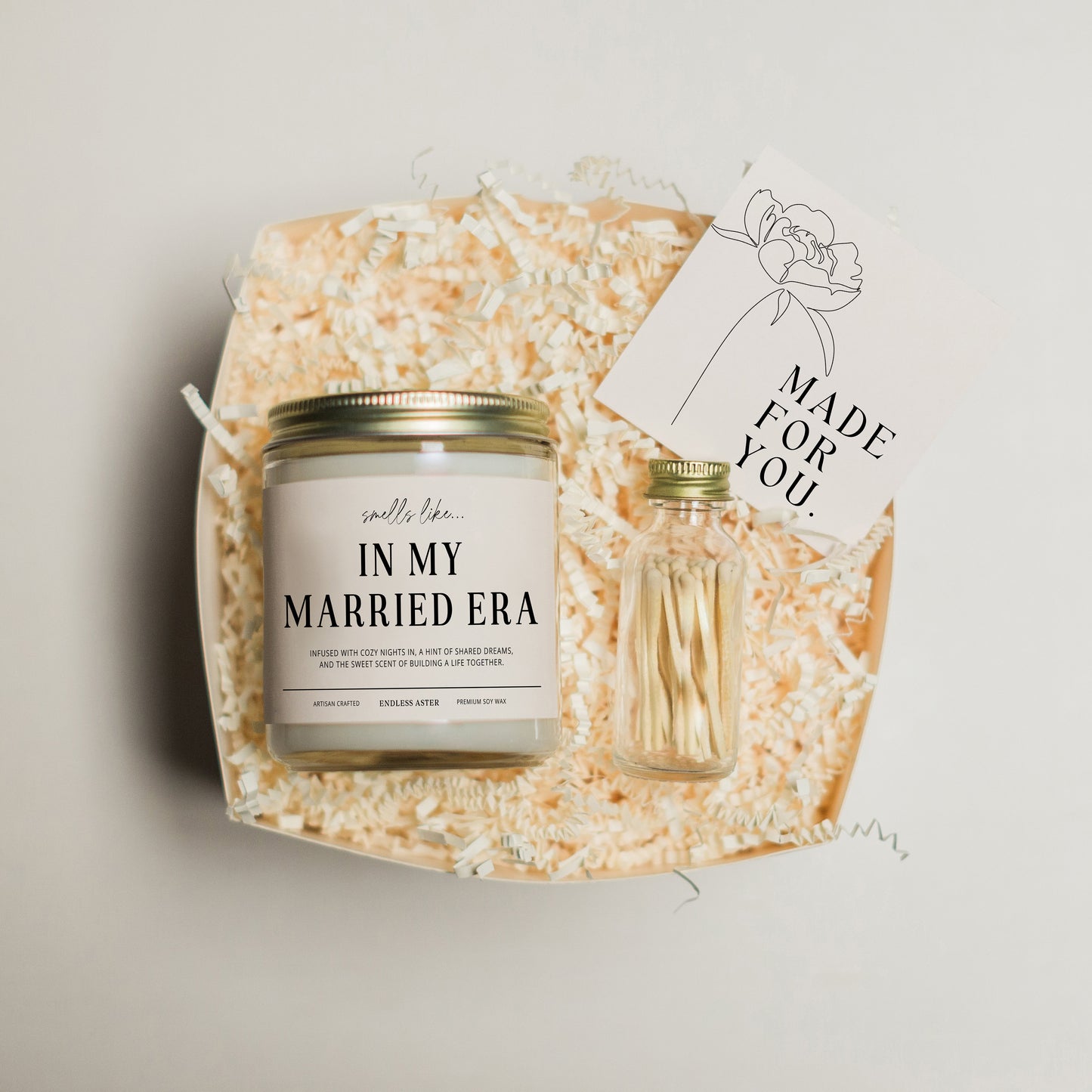 a jar of wedding favors and a card on a tray