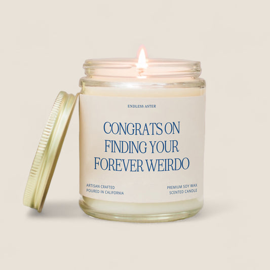 a candle with a label on it that says congrats on finding your forever