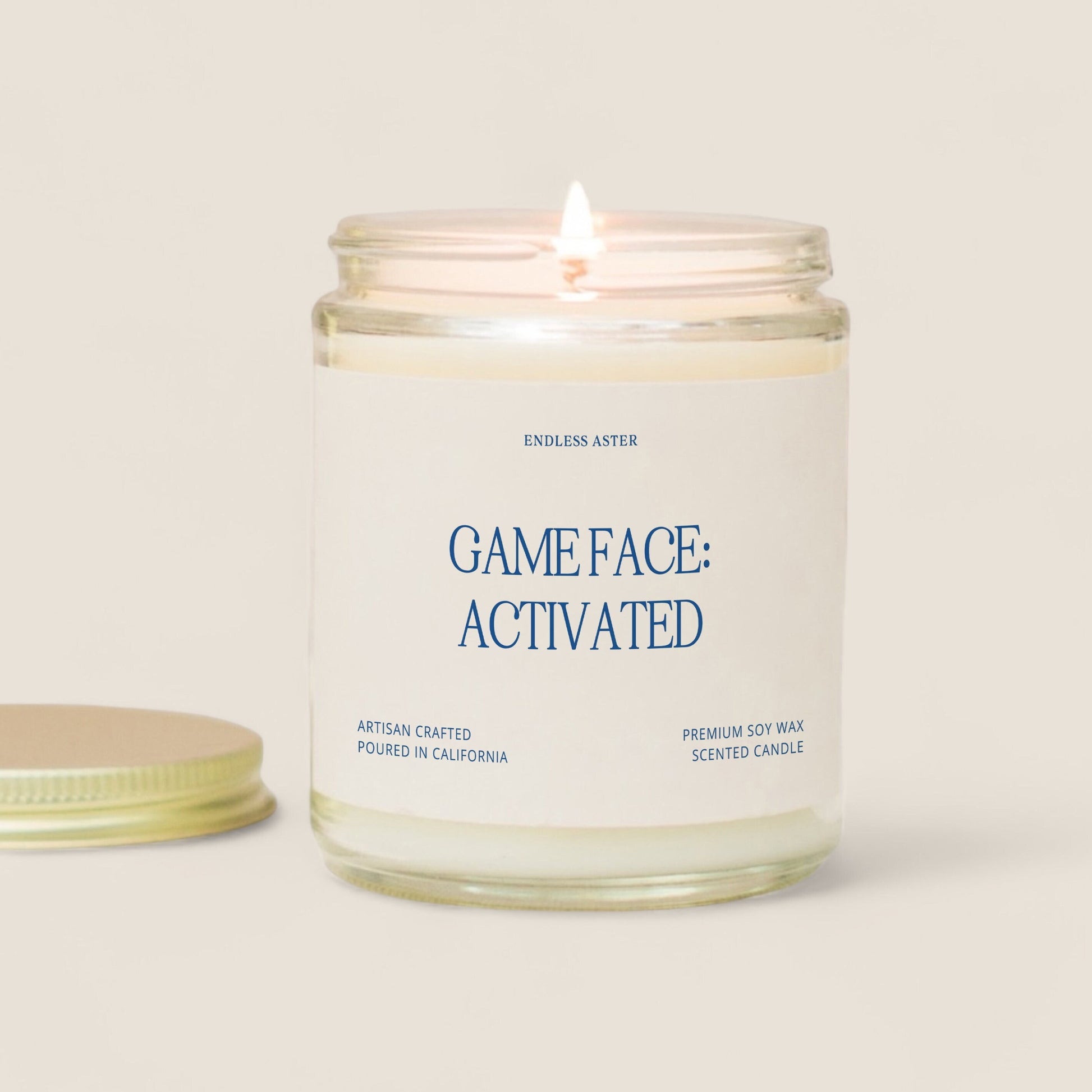 A candle with the saying “game face: activated”