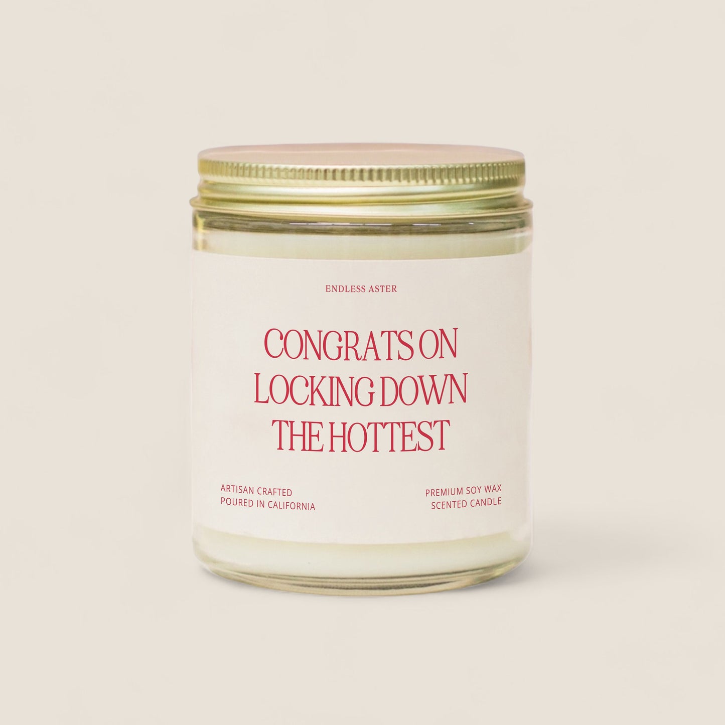 a candle with a label on it that says congrats on looking down the