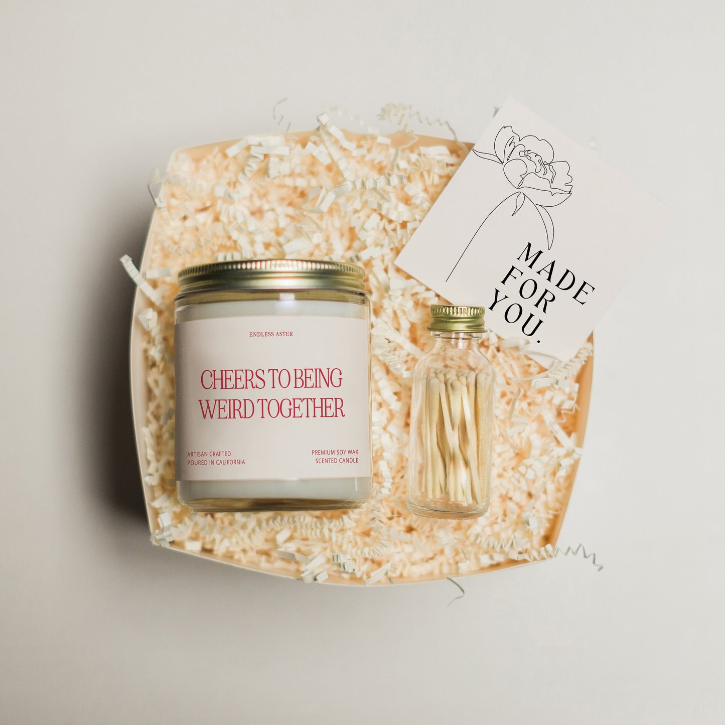 a jar of cheeses and a card on a tray